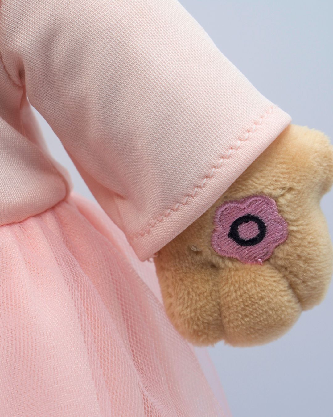 Close-up of Madinas hand, where you press to hear her speak.Islamic plush doll Madina teaching children dhikr and nasheeds