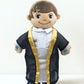 Plush toy in formal attire on white background. Islamic talking doll Khaled reciting Surah Al-Fatiha.