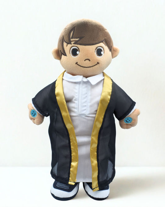 Plush toy in formal attire on white background. Islamic talking doll Khaled reciting Surah Al-Fatiha.